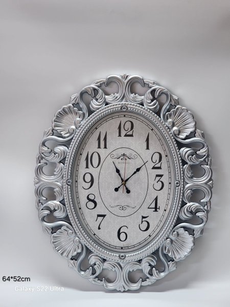 ساعة حائط  بيضاوية64*52سم