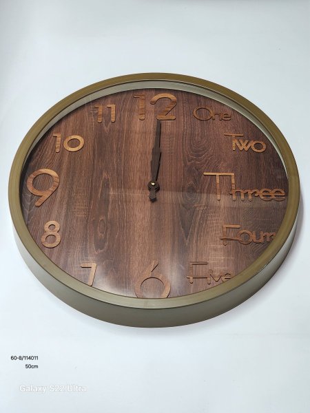 ساعة حائط بلاستيك مقوى لون خشبي قطر 50سم