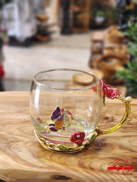 ماج زجاج شفاف يد بيوتر ذهبي