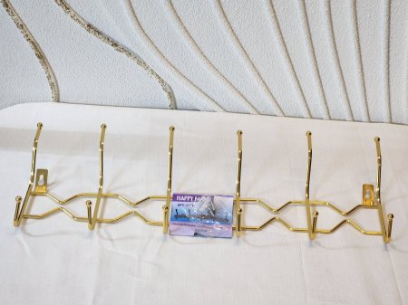 علاقي ملابس حديد لون ذهبي